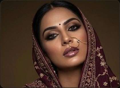 Editorial bridal glam with dupatta, nose ring and smokey eye